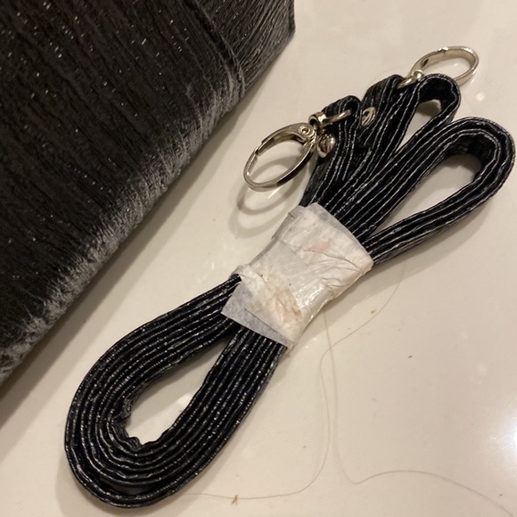 Brand new condition metallic black clutch